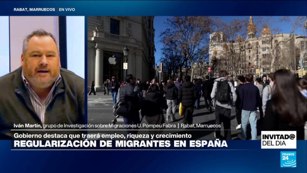 ¿Qué factores impulsaron la regularización de 500.000 migrantes en España?